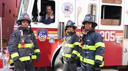 FDNY firefighter Robert Thomas, 61 (seated in apparatus), and his firefighting sons, Stephen Thomas, 25; Jason Thomas, 29; and Nathan Thomas, 27.