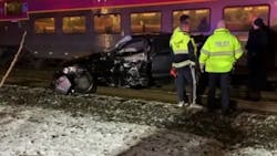 Two Ashland, MA, firefighters pulled several men out of the way of an oncoming train after their car became stuck Thursday night. Two Ashland, MA, firefighters pulled several men out of the way of an oncoming train after their car became stuck Thursday night.