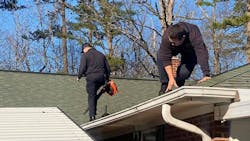 Gastonia, NC, firefighters cleaned out the gutters for a man who they had earlier rescued from him from his roof. Gastonia, NC, firefighters cleaned out the gutters for a man who they had earlier rescued from him from his roof.