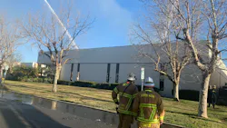 More than 100 Orange County, CA, Fire Authority firefighters battled a massive four-alarm blaze that broke out a nonprofit's warehouse headquarters in Irvine on Sunday.