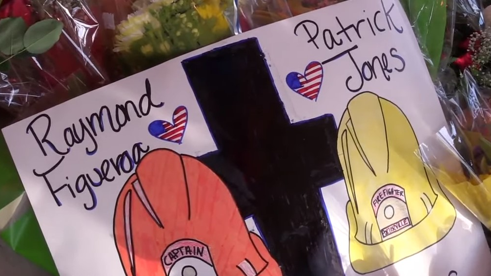 Porterville, CA, residents honor Capt. Ramon Figueroa and firefighter Patrick Jones near the site of a library blaze that claimed their lives last week.