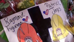 Porterville, CA, residents honor Capt. Ramon Figueroa and firefighter Patrick Jones near the site of a library blaze that claimed their lives last week. Porterville, CA, residents honor Capt. Ramon Figueroa and firefighter Patrick Jones near the site of a library blaze that claimed their lives last week.