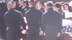 Family, friends and firefighters from around the area attended the funeral of Porterville, CA, Fire Capt. Ramon 'Ray' Figureoa, who died along with firefighter Patrick Jones battling a library blaze last week.