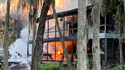 Firefighters from multiple departments kept at a safe distance as ammunition went off while they doused a burning house with water Sunday. Firefighters from multiple departments kept at a safe distance as ammunition went off while they doused a burning house with water Sunday.