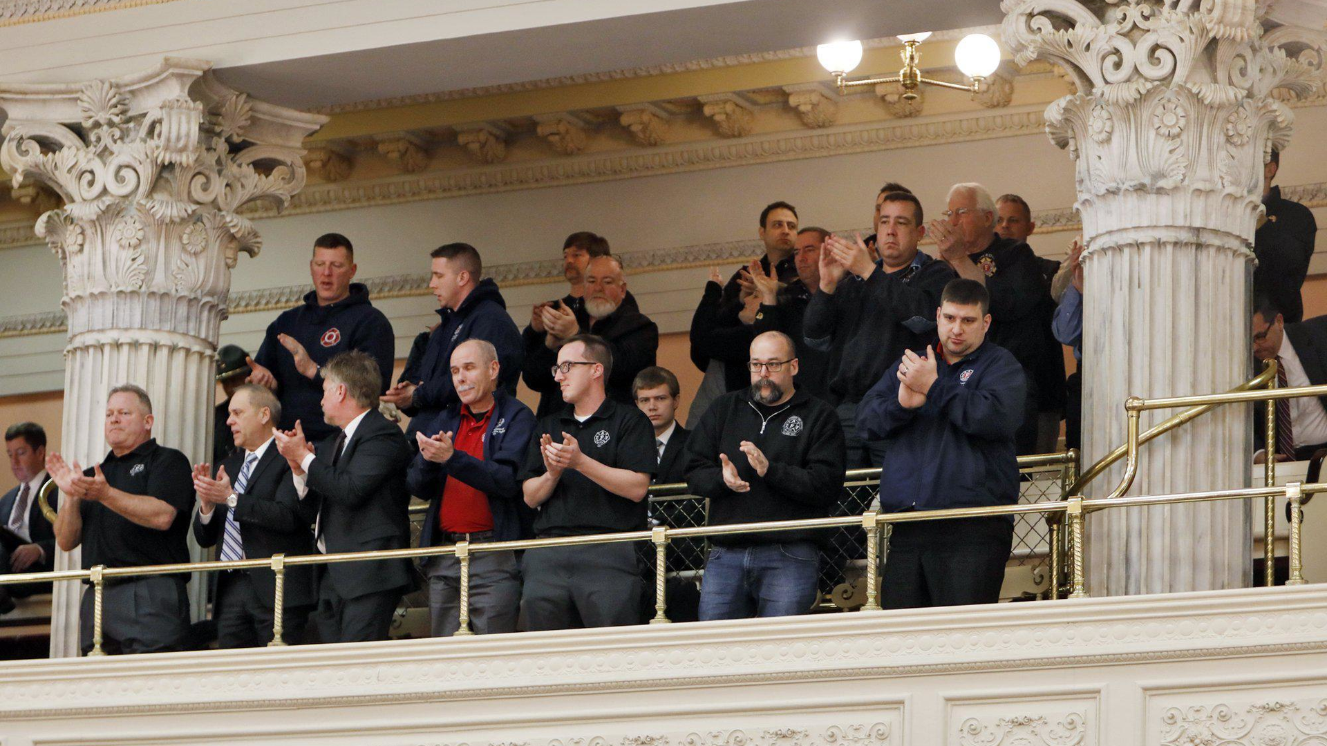 First responders applaud the passage of the first responders workman's compensation bill at the Ohio House of representatives on Wednesday, Feb. 12, 2020.