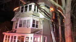 A firefighter was sent to the hospital with minor burns while battling a large three-story fire in Vernon, CT, on Sunday.