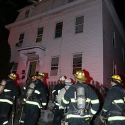 A Worcester, MA, firefighter suffered minor injuries while battling a three-alarm apartment fire early Sunday.