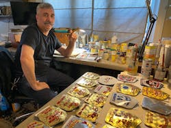 If Stella is ever commissioned to make a helmet shield for a firefighter who serves in Hawaii, he will have made a shield for a customer in every U.S. state. If Stella is ever commissioned to make a helmet shield for a firefighter who serves in Hawaii, he will have made a shield for a customer in every U.S. state.