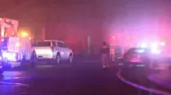An Albuquerque, NM, firefighter was taken to the firefighter after falling through the second floor with another firefighter while battling a house blaze that killed one person early Friday.