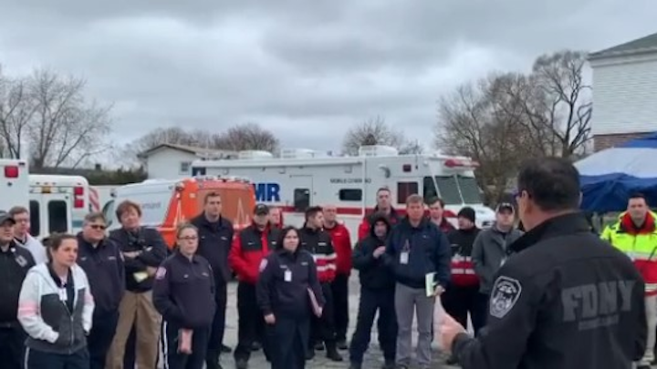 FDNY Commissioner Daniel Nigro (right) greets additional EMTs and paramedics Tuesday at Fort Totten in Queens.