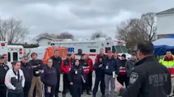 FDNY Commissioner Daniel Nigro (right) greets additional EMTs and paramedics Tuesday at Fort Totten in Queens.