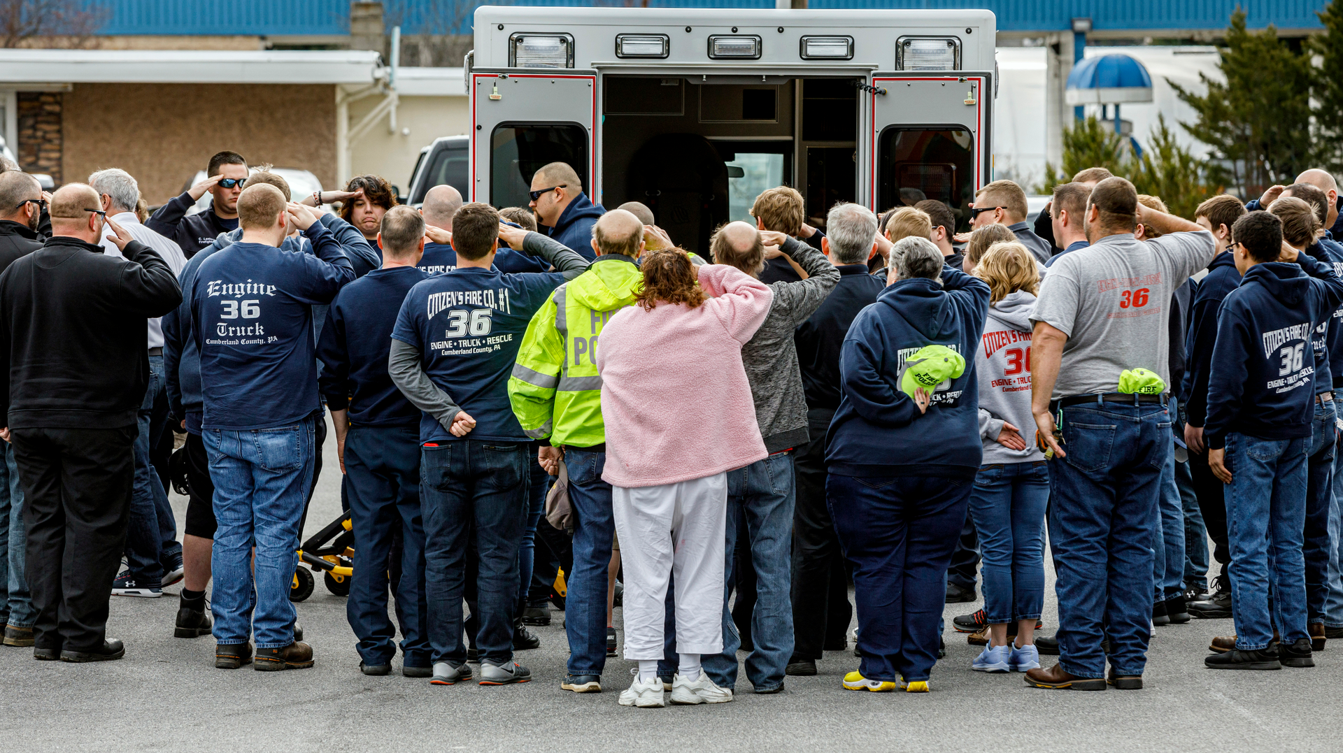 Emergency services personnel pay their respects Tuesday for Citizen's Fire Company No. 1 firefighter Jerome Guise at a Mount Holly Springs, PA, funeral home following a procession for the fallen first responder, who died in the line of duty.