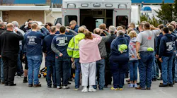 Emergency services personnel pay their respects Tuesday for Citizen's Fire Company No. 1 firefighter Jerome Guise at a Mount Holly Springs, PA, funeral home following a procession for the fallen first responder, who died in the line of duty.