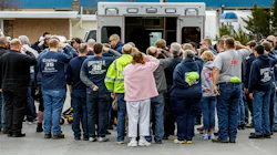 Emergency services personnel pay their respects Tuesday for Citizen's Fire Company No. 1 firefighter Jerome Guise at a Mount Holly Springs, PA, funeral home following a procession for the fallen first responder, who died in the line of duty.