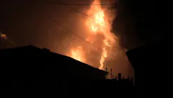A Chicago firefighter was injured after being struck by part of a chimney while battling a residential blaze early Monday.