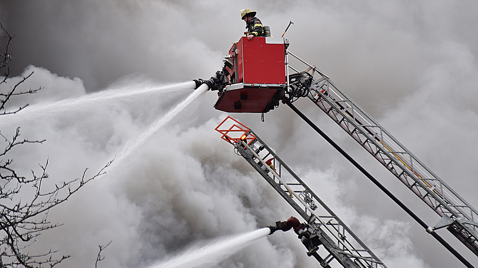 For more than four hours, Minneapolis firefighters battled a four-alarm blaze that spread to multiple buildings Sunday.