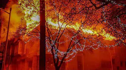 Flames engulfs the roof of an abandoned home as Jacksonville, FL, firefighters began battling it early Monday.