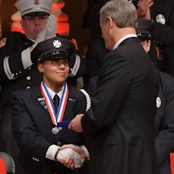 Worcester, MA, firefighter Lea Caldwell is given the Medal of Valor from Gov. Charlie Baker during the 30th annual Firefighter of the Year Awards on Nov. 26. Worcester, MA, firefighter Lea Caldwell is given the Medal of Valor from Gov. Charlie Baker during the 30th annual Firefighter of the Year Awards on Nov. 26.