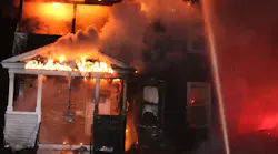 Worcester, MA, firefighters douse the flames of a burning home early Thursday.