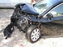 Crash damage to the driver’s side front area of this Toyota Camry Hybrid resulted in responders’ inability to see hybrid badging that was located on the fender. Crash damage to the driver’s side front area of this Toyota Camry Hybrid resulted in responders’ inability to see hybrid badging that was located on the fender.