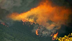 A firestorm of smoke and ash from the Waldo Canyon fire heads down the mountain towards Mountain Shadows neighborhood of Colorado Springs, CO, in 2012. A firestorm of smoke and ash from the Waldo Canyon fire heads down the mountain towards Mountain Shadows neighborhood of Colorado Springs, CO, in 2012.