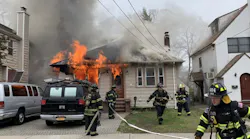 Firefighters from multiple departments battled a blaze Monday at an East Rockaway house that was allegedly set by a 31-year-old man who then fought with two first responders trying save him from the burning residence.
