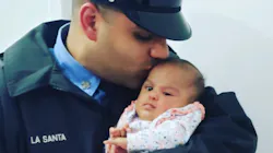 FDNY firefighter Jerel La Santa with his infant daughter, Jay-Natalie, who died of COVID-19.