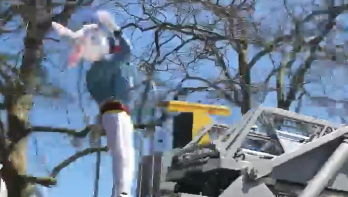 A wind gust knocked off the costume head of a Margate, NJ, firefighter dressed as the Easter Bunny and riding a department aerial Sunday.