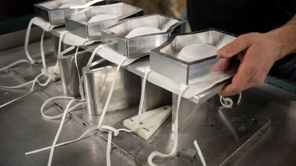 Face masks set on the materials being used to finish them at Duro-Last in Saginaw, MI. Duro-Last is manufacturing isolation gowns and face masks to help the high demand of PPE products during the coronavirus outbreak.