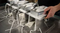 Face masks set on the materials being used to finish them at Duro-Last in Saginaw, MI. Duro-Last is manufacturing isolation gowns and face masks to help the high demand of PPE products during the coronavirus outbreak.