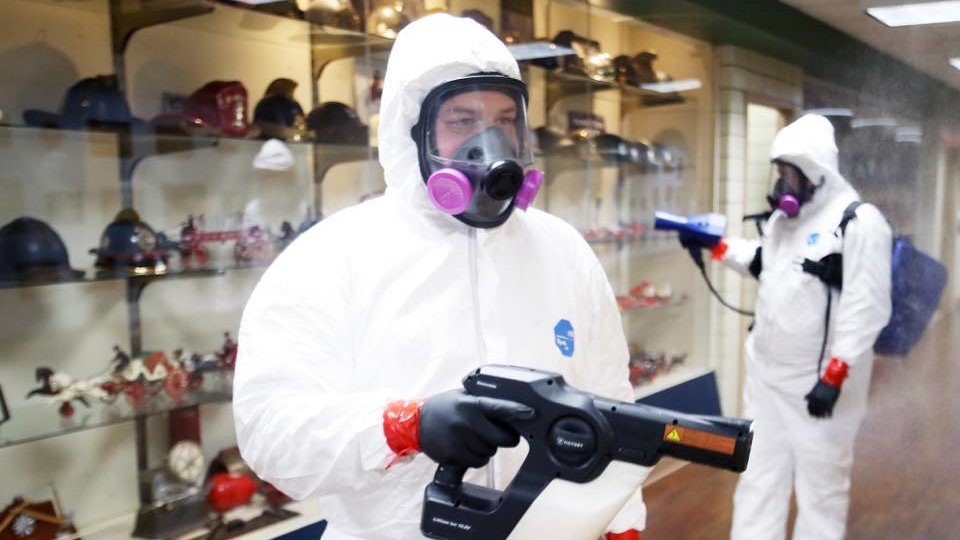 Personnel work to decontaminate St. Louis Fire Department &amp; EMS Headquarters during the COVID-19 pandemic on April 7, 2020.