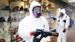 Personnel work to decontaminate St. Louis Fire Department & EMS Headquarters during the COVID-19 pandemic on April 7, 2020.