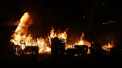 A St. Paul, MN, firefighter was injured early Tuesday after battling a blaze caused by the apparent explosions of aerosol cans or propane tanks, damaging four garages and two homes.