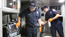 Massilon firefighter/paramedics Anthony Lumpp (left) and Brian Frank sanitize the interior of a medic unit at Fire Station No. 1 in Massillon, OH, on Friday, April 3, 2020. Massilon firefighter/paramedics Anthony Lumpp (left) and Brian Frank sanitize the interior of a medic unit at Fire Station No. 1 in Massillon, OH, on Friday, April 3, 2020.