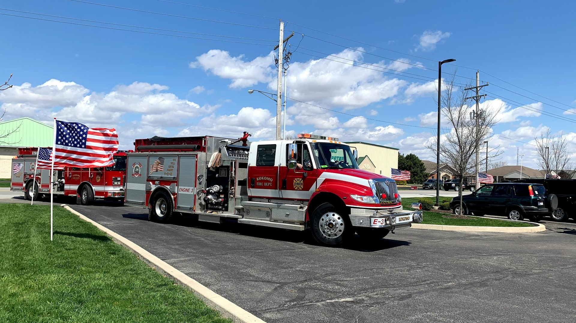 A number of fire apparatus passed by former fire chief Vincent Woodward's home as he celebrated his 100th birthday with his family inside.