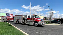 A number of fire apparatus passed by former fire chief Vincent Woodward's home as he celebrated his 100th birthday with his family inside.