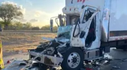 Albuquerque, NM, firefighters freed a driver trapped in a tractor-trailer following a crash with a similar vehicle late Saturday.