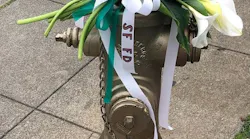 Flowers adorn the fire hydrant at 20th and Church streets, where San Francisco firefighters continuously pumped water for three days to save the Mission District from out-of-control blazes following the 1906 earthquake.