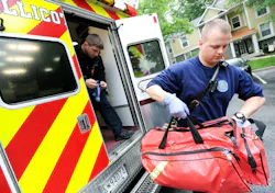 Howard County, MD, paramedic Alex McWethy, left, and EMT Nate Martin prepare to respond to a call for a patient with abdominal pain in this undated photo.