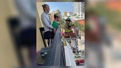 West Palm Beach Lt. Brett Koning is at the tip of the aerial to greet Korey Soderman and his family. West Palm Beach Lt. Brett Koning is at the tip of the aerial to greet Korey Soderman and his family.