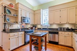 The modern kitchen is located in space that was used as a horse stable in the 1800s. The modern kitchen is located in space that was used as a horse stable in the 1800s.