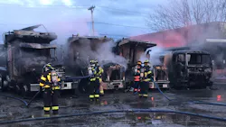 Firefighters from Andover, MA, and other departments Andover Fire Rescue extinguished a blaze involving four dump trucks and an oil tanker Friday.