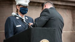 Hoboken, NJ, Office of Emergency Management Director Sgt. William Montanez pins the badge on his fiancée, Audra Carter, who becomes the first woman in the fire department's 171-year history to become battalion chief. Hoboken, NJ, Office of Emergency Management Director Sgt. William Montanez pins the badge on his fiancée, Audra Carter, who becomes the first woman in the fire department's 171-year history to become battalion chief.