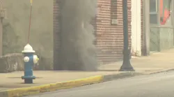 Bluefield, WV, firefighters evacuated part of the downtown area after three explosions erupted from a manhole Wednesday.