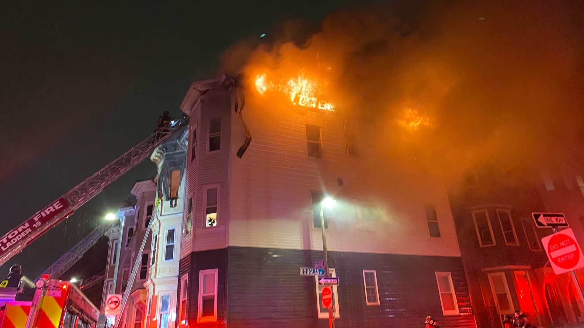 Five Boston firefighters suffered minor injuries battling a seven-alarm blaze that tore through several residential buildings in South Boston early Saturday.