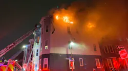 Five Boston firefighters suffered minor injuries battling a seven-alarm blaze that tore through several residential buildings in South Boston early Saturday.