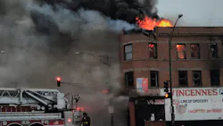 Chicago firefighters battled a three-alarm blaze that broke out out a building in the West Chatham neighborhood Tuesday.