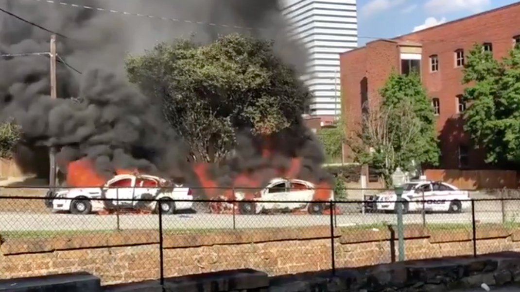 A Columbia, SC, firefighter was injured Saturday after peaceful demonstrations turned violent. Protesters also set fire to three police cars.