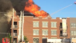 Columbus, OH, firefighters battle a three-alarm blaze at the construction site of an apartment building on South Washington Avenue Downtown early Sunday morning. Arson is suspected.