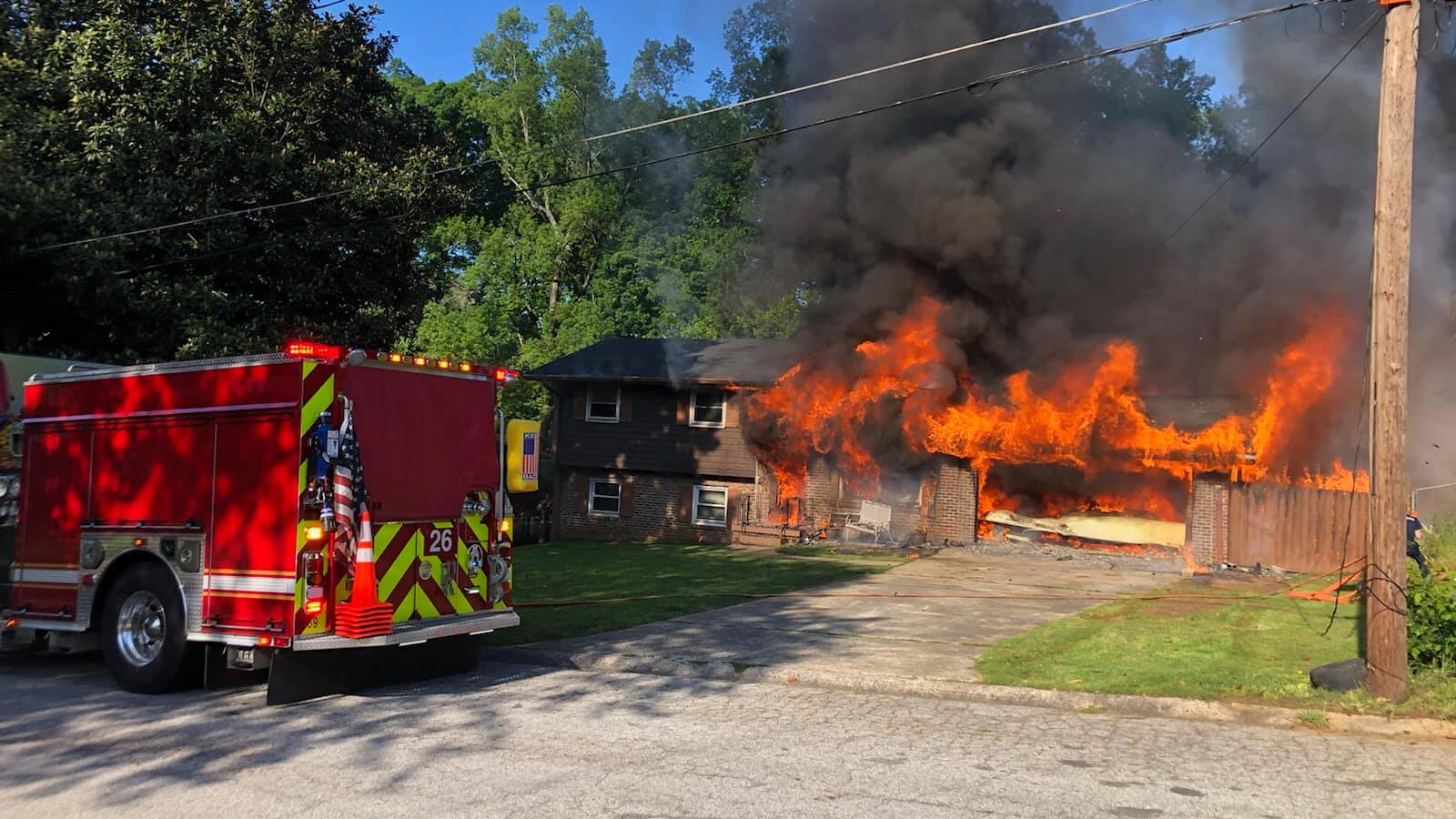A DeKalb County, GA, firefighter was injured while battling a blaze that broke out at two houses Friday.